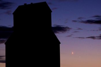 The planets Mercury and Venus (lower right) were very close together in the night sky in early January. This photo shows them with the Holmquist elevator along Highway 12 on Jan. 10.