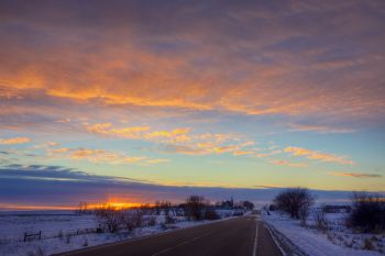 Sunset sky above the road to West Nidaros Church near Baltic.