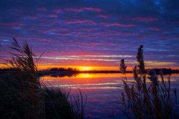 Colorful post sunset cloud reflections at Mud Lake in Turner County.