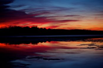 A late winter Lake Vermillion sunset after a melt and refreeze.