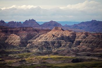 Mid-morning sunshine breaking through over Badlands National Park.