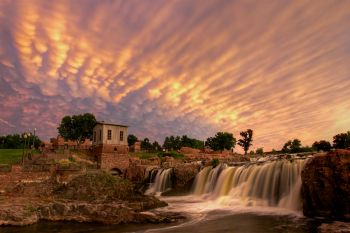 Dramatic mammatus clouds above Falls Park at sunset.