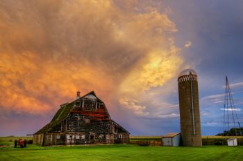 Storm clouds over a barn and silo east of Dell Rapids.