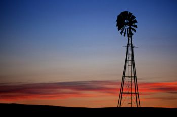 The sunset I was watching with a lone windmill silhouetted against the sky.