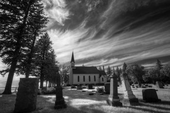 Old and leaning tombstones at Wood Lake Lutheran of Deuel County.