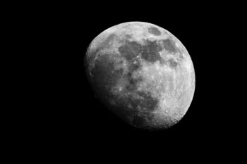 The rising moon as seen from a church yard in Lincoln County.