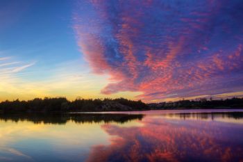 If you look long enough, the clouds appear to be a great sky dragon chasing the setting sun out of the sky above Lake Alvin.