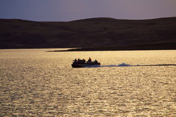 Fishermen calling it a day and heading for the dock.