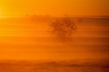 Sunset at the end of a prairie blizzard.