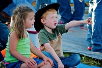 Little cowpokes getting ready to watch the rodeo.