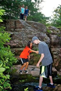 Logan Nussbam and Matt Bruns explore the stream just above Devil’s Falls just outside of Garretson.