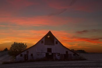 Later in the evening, the clouds above the barn changed from yellow to orange to pink.