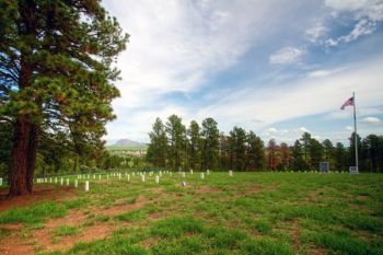 Old Fort Meade Cemetery with a view of the fort itself and Bear Butte through the break in the trees.
