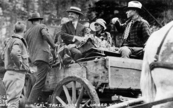 While in South Dakota, Silent Cal took a ride in a lumber wagon.