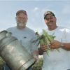 Chefs Larry Wilson, left, and Marty Bigge steam dinners inside vintage cream cans.