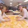Susan Schroeder and Barb Perk turn drying noodles in Tabor s Legion Hall.