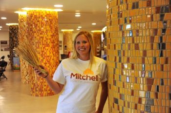 Katie Knutson shows the newly-decorated columns in the Corn Palace lobby.