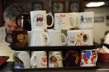 Sassy coffee cups are used as decor in the Open Door restaurant.