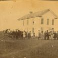 Pioneer politicians and members of the  Yankton gang  gather at the first territorial capitol in downtown Yankton.
