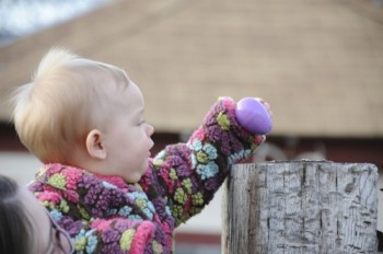 Even the very young enjoy the thrill of the Easter egg hunt. Photo by Bernie Hunhoff.