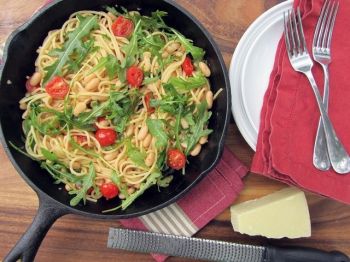 Garlic spaghetti with beans and arugula contains pantry staples jazzed up with a couple of garden-fresh favorites. Photo by Fran Hill.