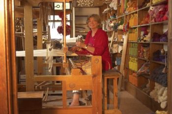 Grete, creating designs on the loom.