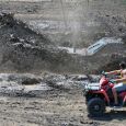 Kevin Wright, Rapid City, plows through a bog in his Mud Mafia  Scrat  truck.