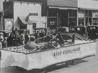 Keep Geddes Caged  was the theme of this float, filmed by Lawrence Cool of Platte.