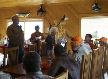 Auctioneer Randy Owen, Mother of God Monastery Communications Director Jennifer Vik and Prioress Sr. Marlene Minnaert.