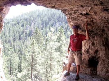 Standing by the cave's back door.