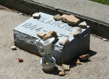 A vintage vase decorates the grave of Blanche Colman, South Dakota's first female lawyer.