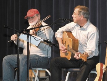 Well-known fiddler Owen DeJong (left) of Wakonda and singer John McNeill of Springfield are regulars at the Gayville Hall.