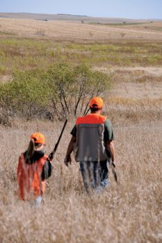 Jim Zimmerman and his daughter, Shelby, hunt a creek bottom in Gregory County.