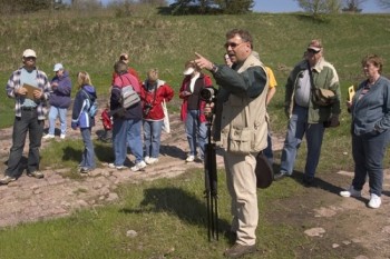 Sioux Falls Camera Club member Marty DeWitt offers instruction during an afternoon photography workshop at Palisades State Park near Garretson.