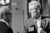 Lobbyists Larry Mann and Bob Riter talk strategy in the Senate lobby preparatory to a Senate vote on a bill they re working.