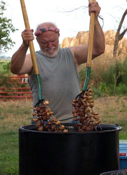 Pitchfork fondue cook Keith Williams pulls finished meat out of the hot oil.