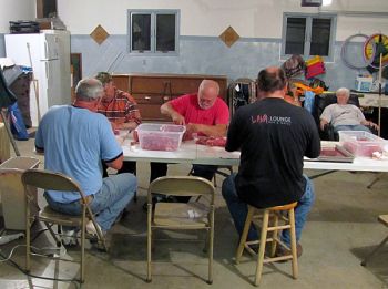 The meat-cutting crew includes (from left to right) Scott Olson, Tom Congar of Buffalo Gap, Keith Williams and Jay Cutts. Photos by Cyndi Beers and LeAnne Cutts. Click to enlarge photos.