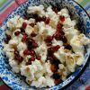 Pomegranate seeds provide antioxidants and a sweet counterbalance to a bowl of salty popcorn.