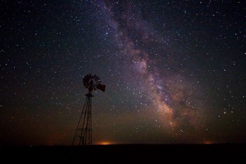 Taken just south and east of Isabel, SD in June. The lights of Eagle Butte, SD are on the horizon.