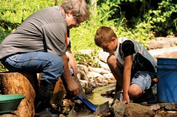 Deadwood Gulch, deep in the Black Hills near Rockerville, is a claim site for Don Hamm (left) and other members of the Black Hills Prospecting Club.