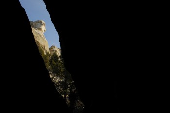 A boulder crack on the Presidential Trail provides a unique look at the Shrine of Democracy.