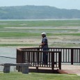 A visitor studies the river valley from an overlook in downtown Springfield.