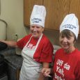 Sheryl Steinocker and Diane Knutson carefully watch over the boiling pots of lutefisk.