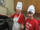 Sheryl Steinocker and Diane Knutson carefully watch over the boiling pots of lutefisk.