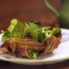 A bacony nest of mixed salad greens topped with garlic dressing. Photo by Bernie Hunhoff.