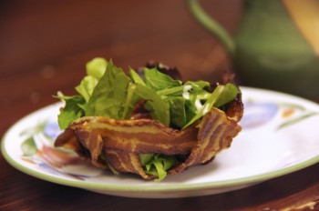 A bacony nest of mixed salad greens topped with garlic dressing. Photo by Bernie Hunhoff.