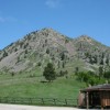 Some say Bear Butte looks like a pregnant woman reclining or a bear lying on its side. It was formed by volcanic-like forces beneath the earth s surface. Photos by Rebecca and Jeremy Johnson.