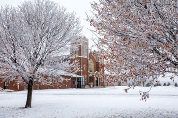 St. John’s Evangelical Lutheran in rural Douglas County framed by frosted trees.