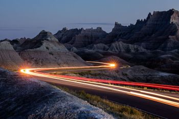 A long exposure of traffic near the Yellow Mounds in the blue hour.