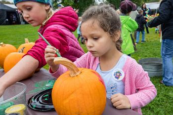 Painting pumpkins at the Fall Festival.